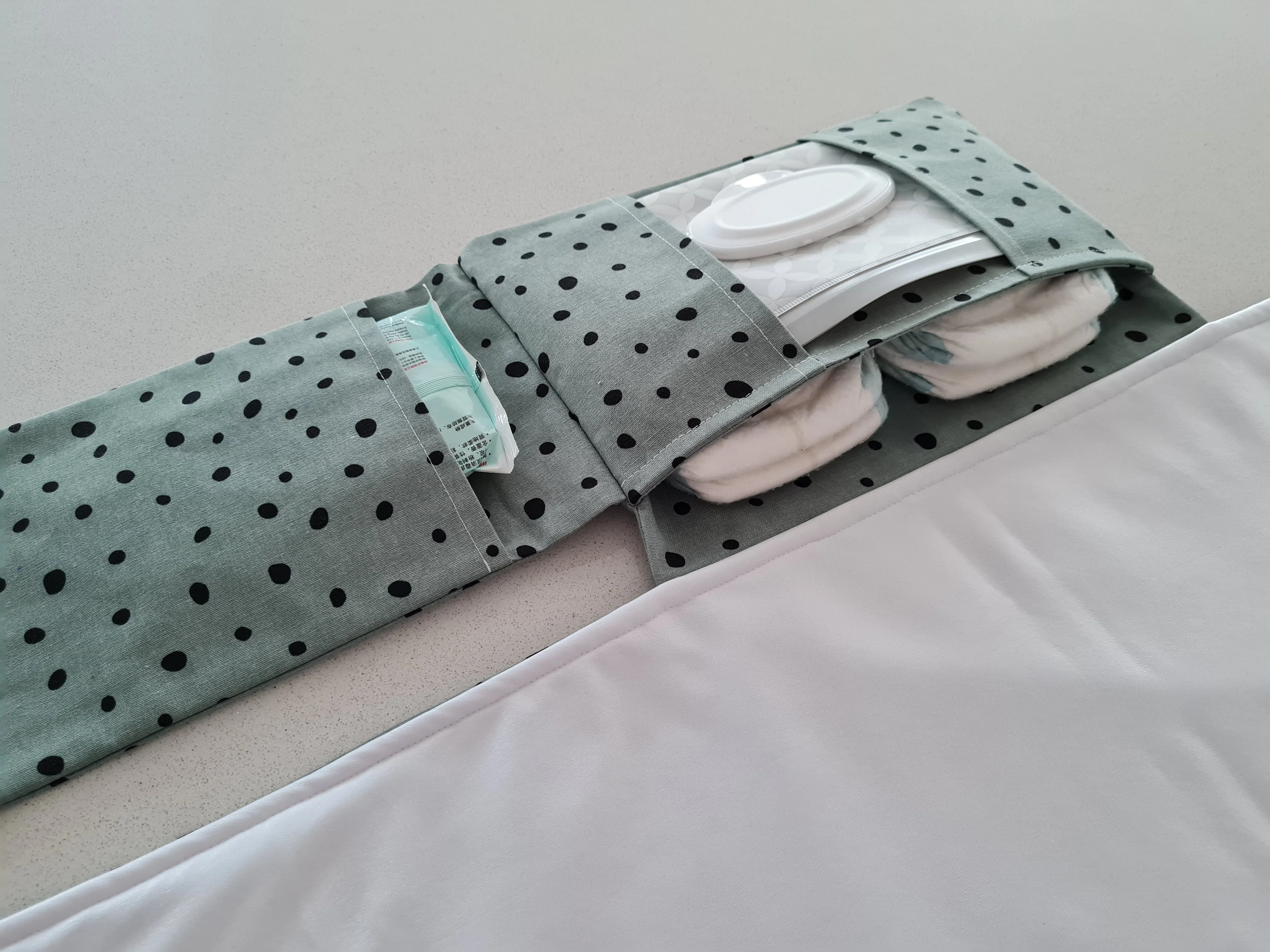 Dots on Green Nappy change mat clutch (Pre Order - Dispatches 10 - 12 days)