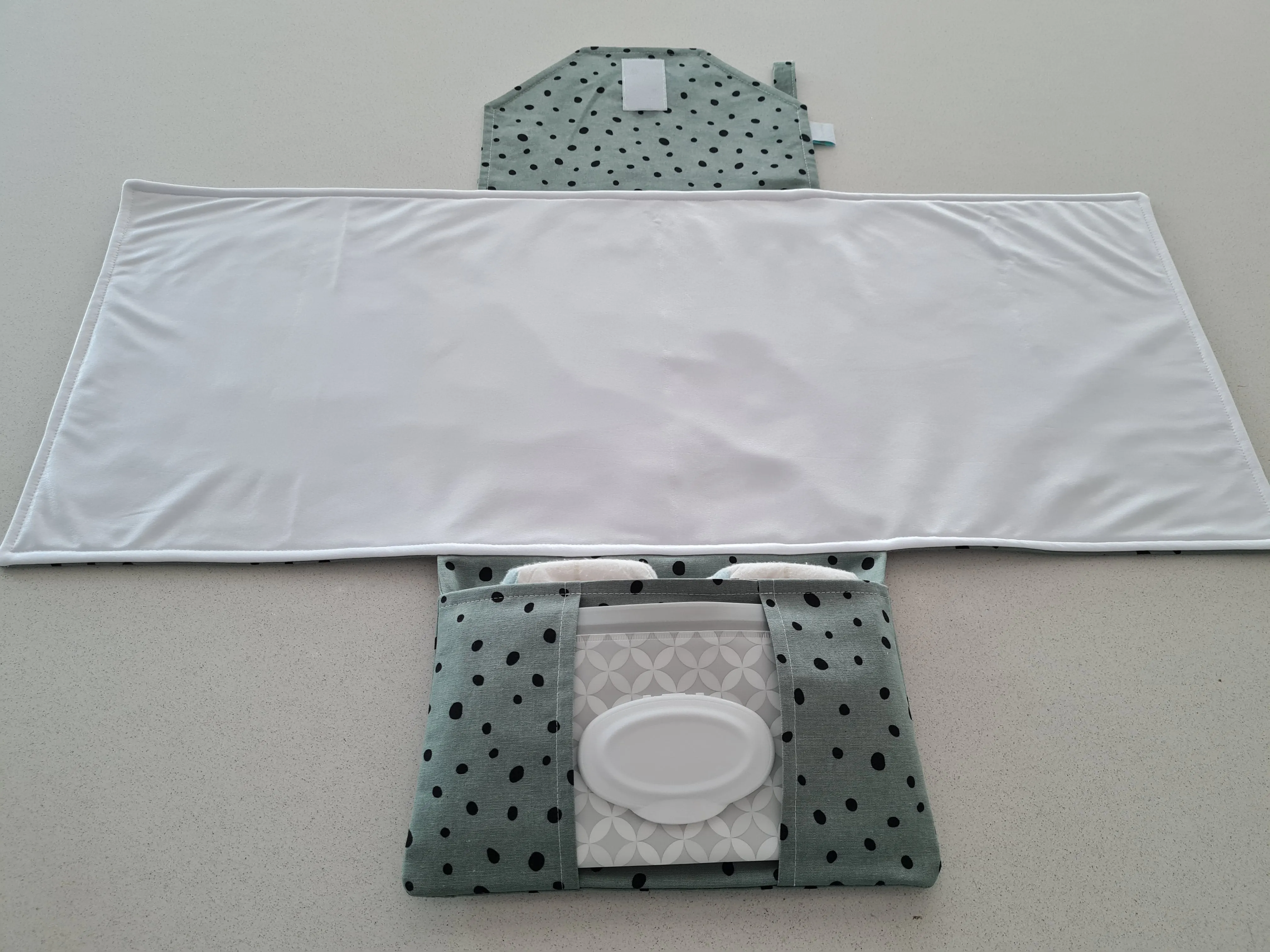 Dots on Green Nappy change mat clutch (Pre Order - Dispatches 10 - 12 days)