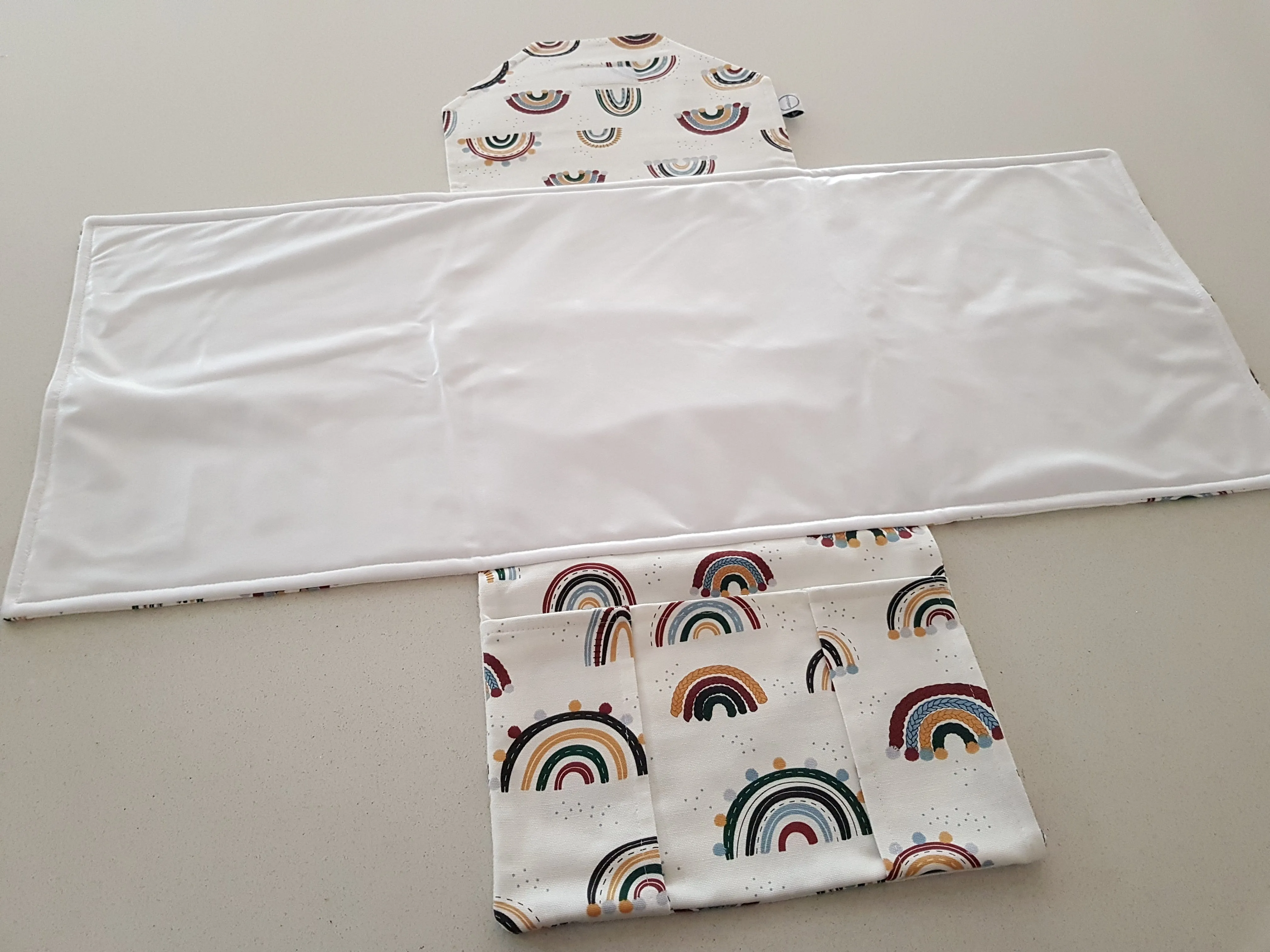 Rainbows & pom poms Nappy change mat clutch (Pre order - Dispatches in 10 - 12 days)